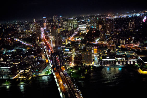 istock Manhattan Brigde in New York at night captured from a helicopter 1070964876