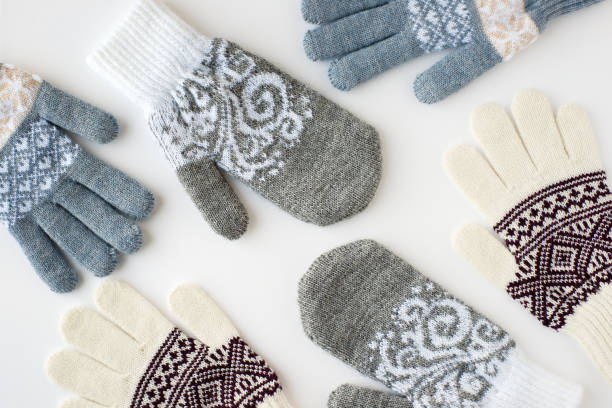 istock Mittens and gloves scattered on a white background. View from above. 1070967126