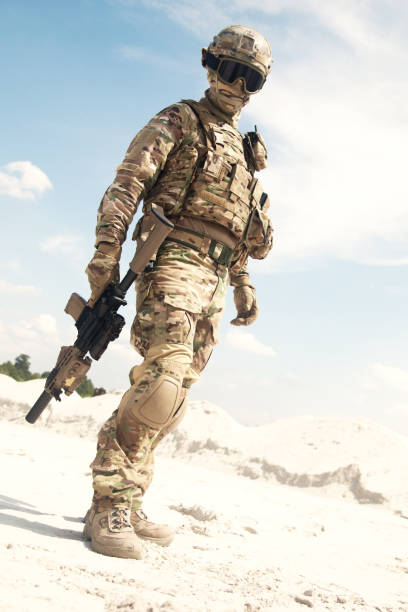 istock War games player equipped with tactical ammunition 1070970900