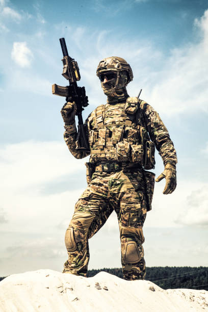 istock Airsoft player witt gun taking part in war games 1070970968