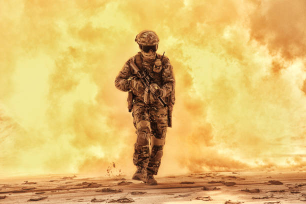 istock Army soldier breaking through battlefield covered flame 1070971148