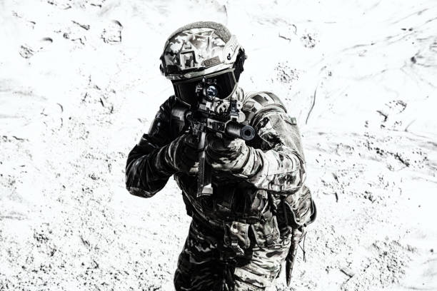 istock Airsoft war game player shooting with gun replica 1070971156
