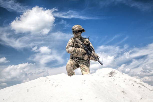 istock Airsoft games shooter during event in sandy area 1070971342