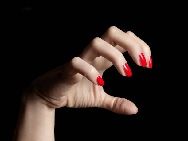 istock close-up female manicured hand like a claw 1070971730