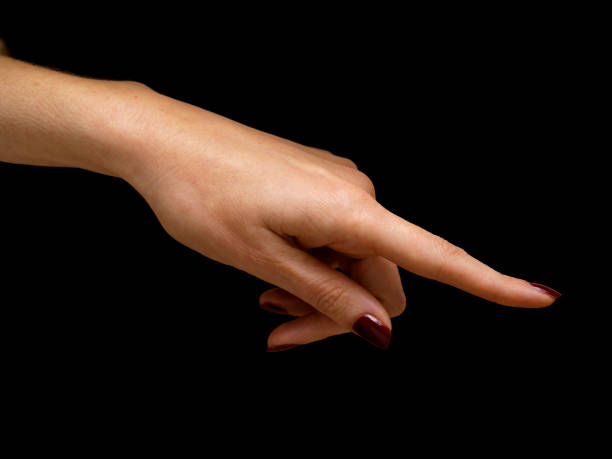 istock female hand with red nail polish on black background 1070973346