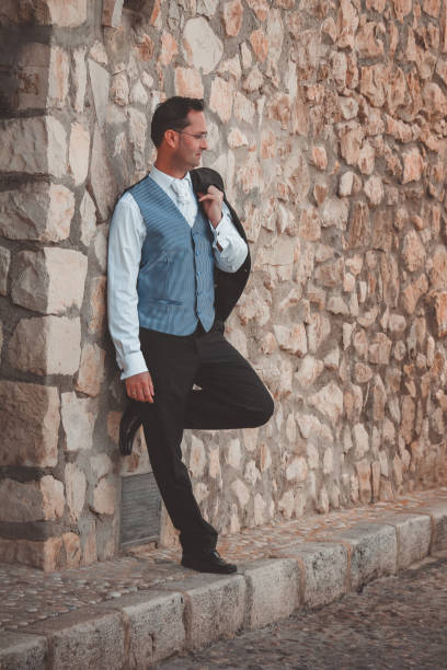 istock Stylish groom posing in the street 1070973926