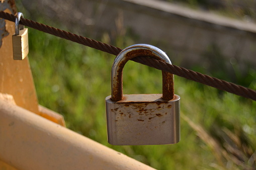 Chained love represented by a union that represents a padlock that symbolizes eternal love.