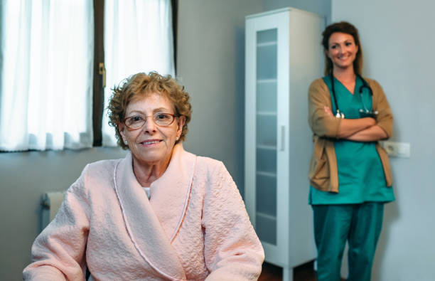 istock Senior patient posing with doctor in the background 1070981196