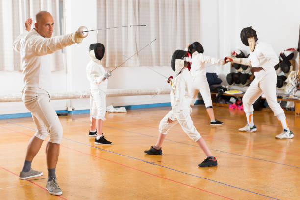 istock Portrait of glad focused practicing with foil 1070983844