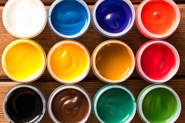 istock Various paints on the old wooden table . Creative concept. Top view 1070990660