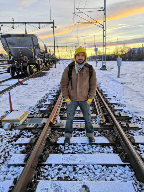 istock Man waiting in the snow for his train to kiruna 1070994616