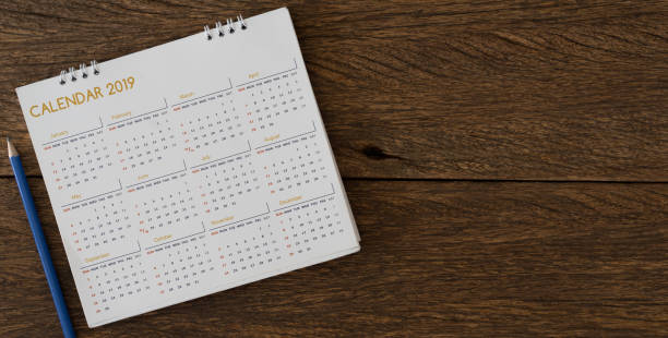 close up soft focus on yellow pencil over calendar 2018 at office desk with top view for make appointment or remember important event on date concept close up soft focus on yellow pencil over calendar 2018 at office desk with top view for make appointment or remember important even on date concept 2019 photos stock pictures, royalty-free photos & images
