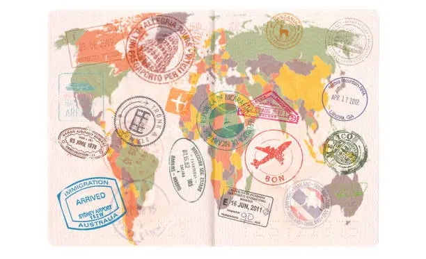 Photo of Opened passport with Visas, Stamps, Seals. World Map Travel or Tourism concept