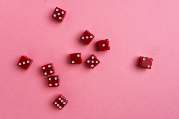 istock Red gaming dices on pink background 1071002090