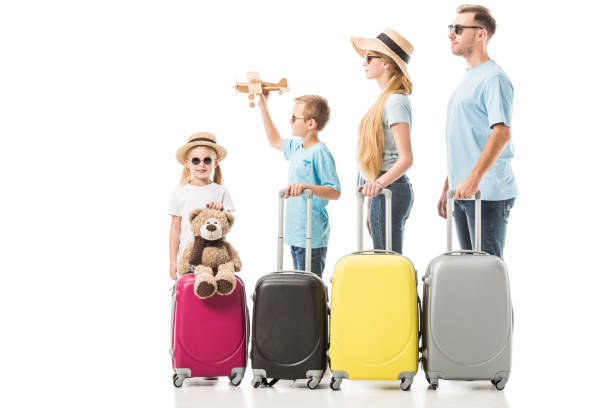 istock Happy family standing with baggage isolated on white 1071003850