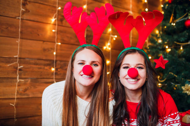 istock Funny girlfriends taking a selfie . Christmas mood. 1071006096