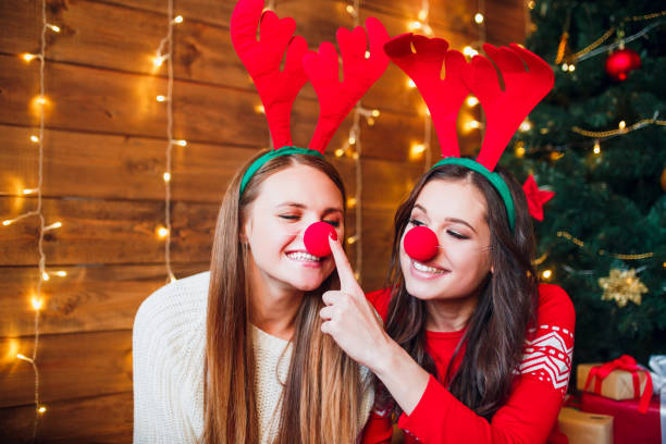 istock Funny girlfriends taking a selfie . Christmas mood. 1071007050