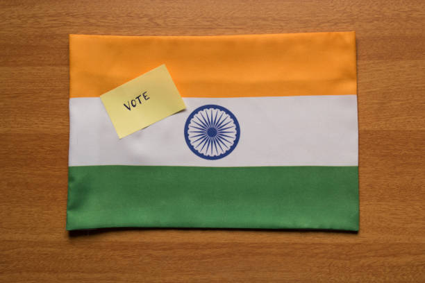 istock Voting concept - Hand Written Voting Sticker on Indian Flag. 1071010932