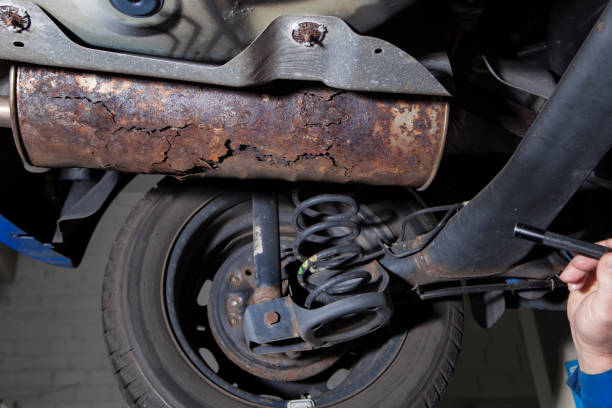 istock Auto repair shop - low-angle view, exhaust system 1071012118