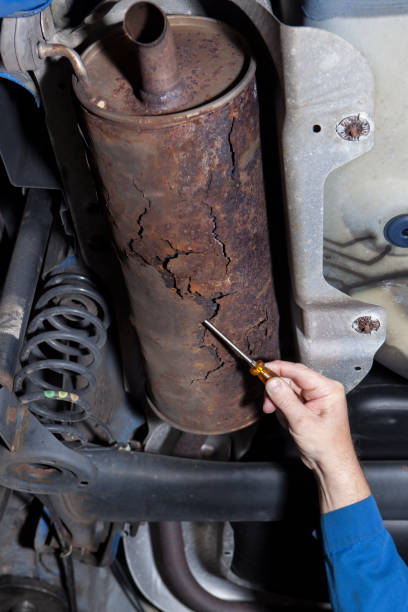 istock Auto repair shop - low-angle view, exhaust system 1071013260
