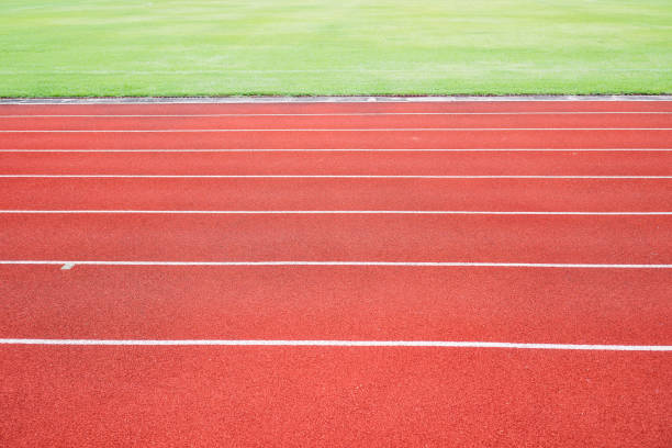 istock Running track for athletic competition texture. Race for training sport with lane background copy space, nobody runner tracks athietic competition in sunny day. 1071013984