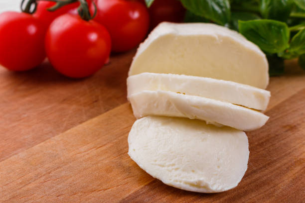 istock Mozzarella tomatoes and basil on a wooden rustic background 1071014612
