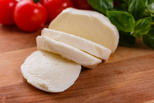 istock Mozzarella tomatoes and basil on a wooden rustic background 1071014614