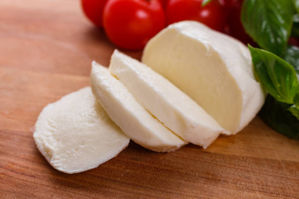 istock Mozzarella tomatoes and basil on a wooden rustic background 1071014632