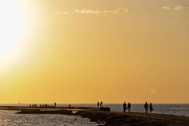 istock breakwater in the sea with red lighthouse at the end 1071016226