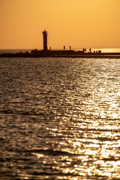 istock breakwater in the sea with red lighthouse at the end 1071016302