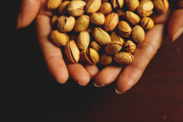 istock pistachio, pistachio in brown 1071018940