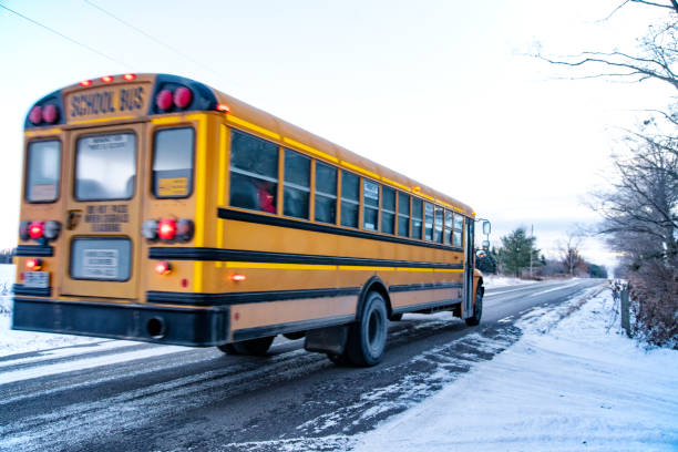 istock School bus on a rural, winter road. 1071019822