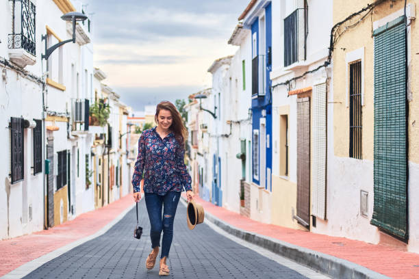 istock Young woman walking in old town 1071024836
