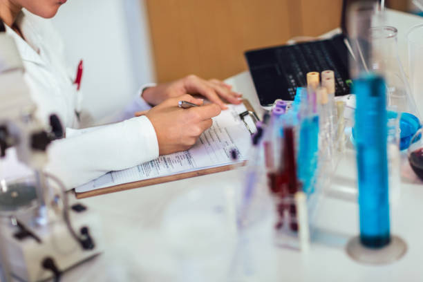 istock Young medical student learning and writes in laboratory 1071025434