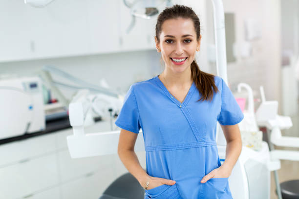 istock Female dental assistant in office 1071025654