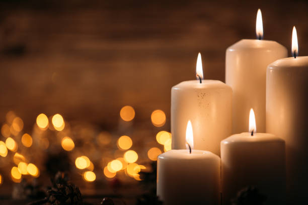 istock Christmas candles on rustic wooden table 1071025678