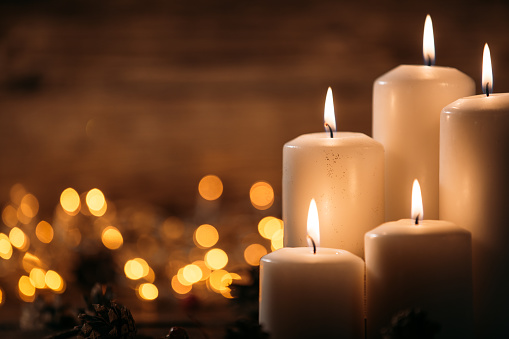 Christmas candles on rustic wooden table