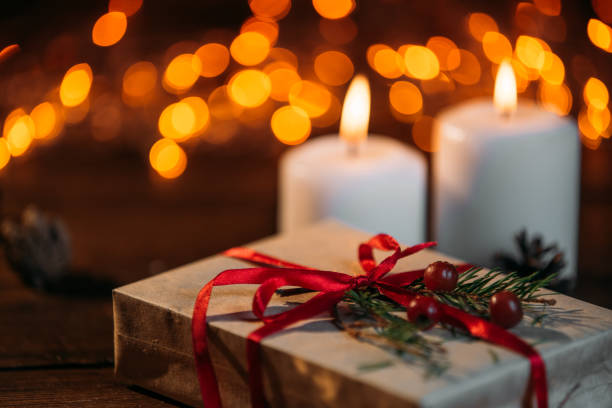 istock Christmas candles on rustic wooden table 1071028178