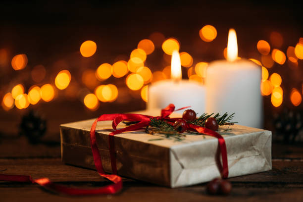 istock Christmas candles on rustic wooden table 1071028238