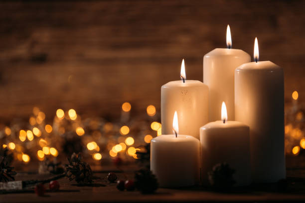 istock Christmas candles on rustic wooden table 1071028270