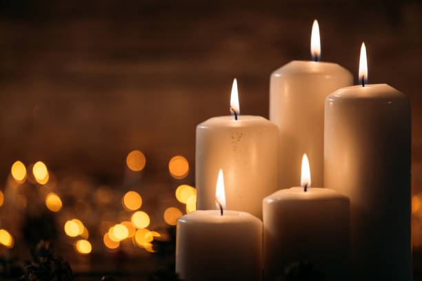 istock Christmas candles on rustic wooden table 1071028298
