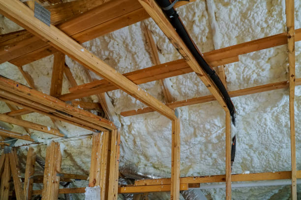istock Installing thermal foam polyurea insulation under the roof wool panels and wooden planks 1071028310