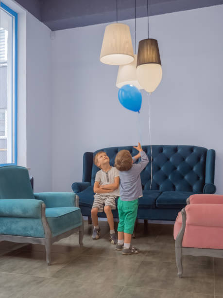 istock Children celebration background. Happy children playing indoor. Classical interior background. Happy kid relaxing at home. 1071036628