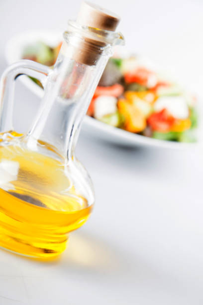 istock Greek salad with olive oil bottle. 1071036636