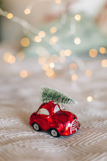 istock Festive decor car red Christmas tree roof 1071036880