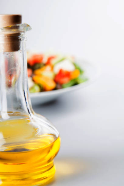 istock Greek salad with olive oil bottle. 1071037092