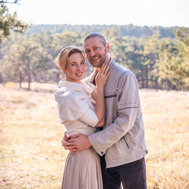 istock Couple in love hugging in the forest. 1071037296
