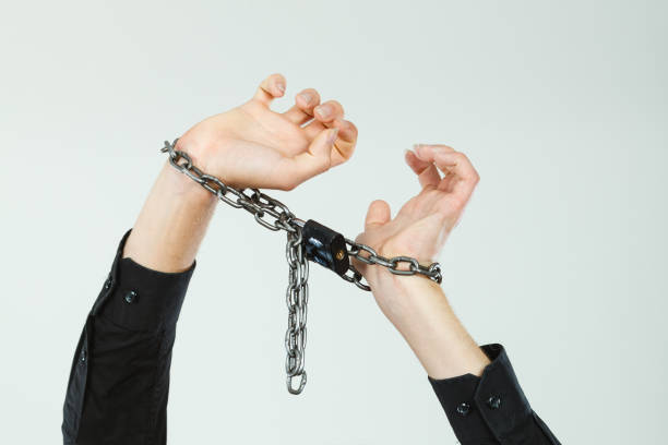 istock Man with chained hands, no freedom 1071039268