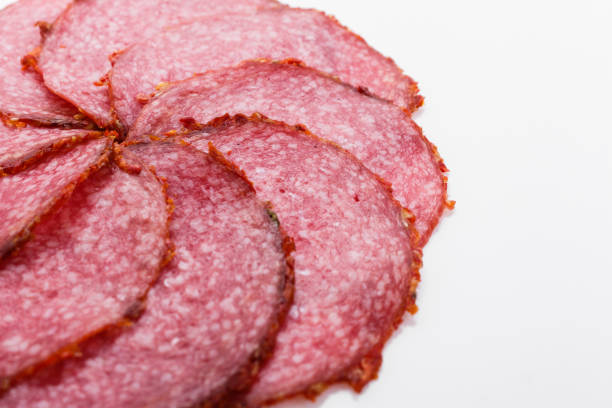 delicious sliced salami on a white background.