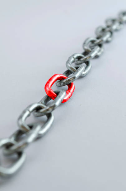 istock Diagonal metal chain, with red link 1071040882